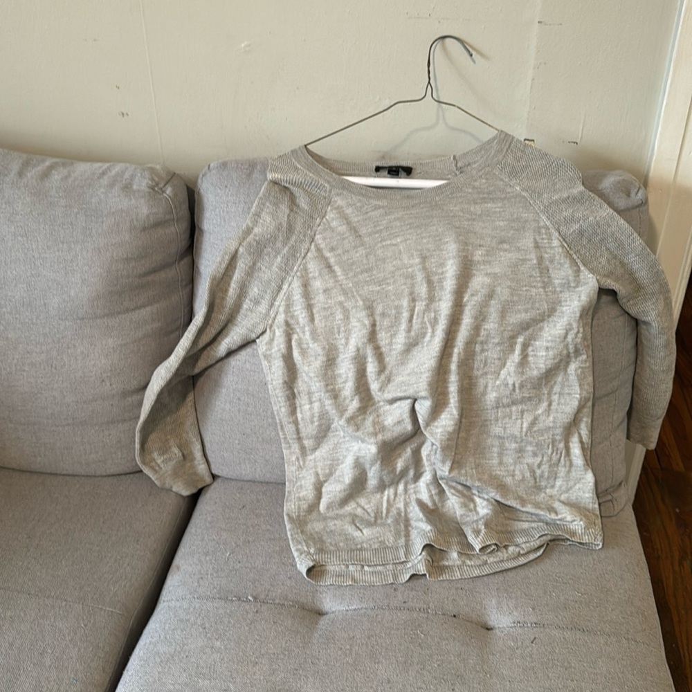 This is a cute lightweight gray sweater in a size medium from J Crew